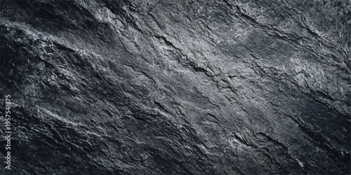 Rough dark grunge wall with a natural black wood and old stone pattern surface showing a macro closeup of weathered grey rock texture and brown bark material