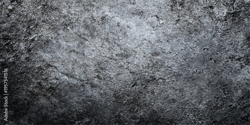 A rough grunge concrete wall texture background featuring a cold grey cement surface with an old dirty stone pattern and macro marble material design
