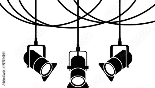 Black stage spotlights hanging from wires a white background theater concert