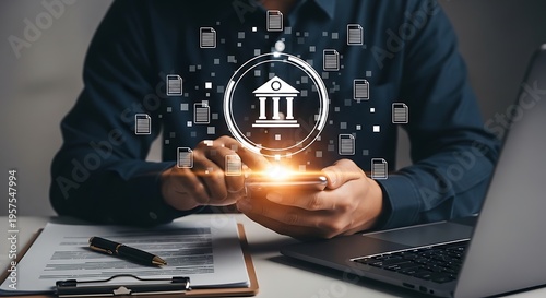 Man holding smartphone with digital bank and documents on desk digital bank documents laptop