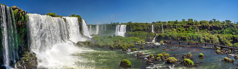 Leinwandbilder Khaki Iguazu Falls Brazil wide panorama of powerful cascades green jungle islands and misty subtropical landscape  © ronedya