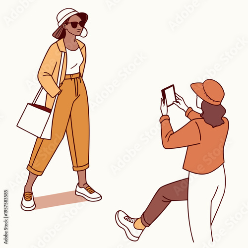 A woman taking a photo of another woman
