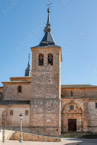 Church of Saint John the Baptist with bell tower and Baroque entrance in Jadraque, province of Guadalajara, Spain.