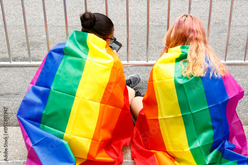 New York City, NY  USA  Pride March 2017 Couple wrapped in rainbow pride flags LGBTQ lifestyle moment Editorial ONLY