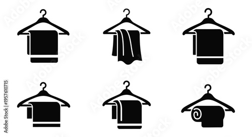Black silhouette icons of hanging towels on coat hangers