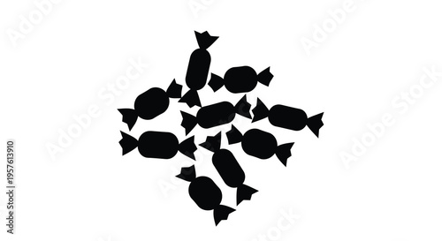 A scattered collection of wrapped candies in a dark silhouette