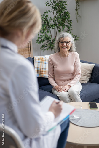 Doctor visiting senior woman for home healthcare checkup