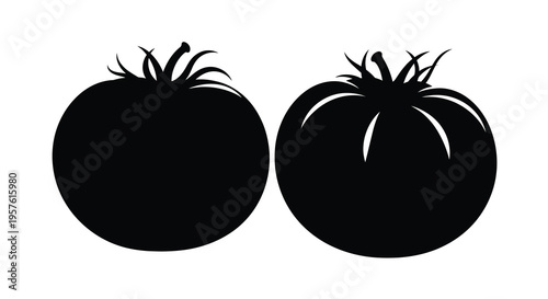 Two ripe tomatoes depicted as bold black shapes a striking silhouette