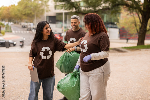 Multiethnic friends volunteering in park cleanup