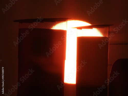 Photography Dramatic close-up of a massive orange sun rising on the horizon, captured with a