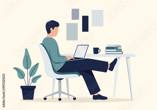 Relaxed man working on laptop at desk in comfortable home office setting