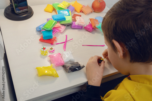 Child engaging in creative modeling clay art activity