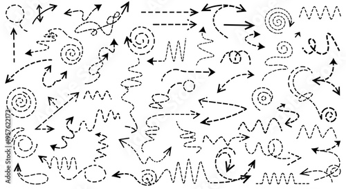 A messy collection of various arrows and swirling shapes scattered across a plain white surface in a chaotic pattern.