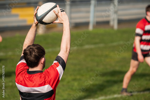 Rugby player throwing a line out during a match