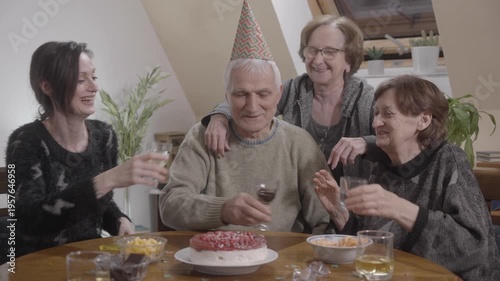 Family and friends celebrate birthday party drinking a wine and singing