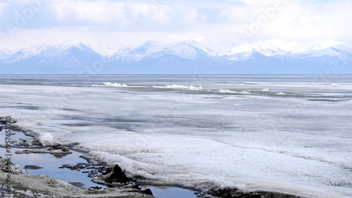 The icy shore of Lake Baikal in Russian Siberia in late spring. The northernmost point of Lake Baikal is located in the small town of Nizhneangarsk.