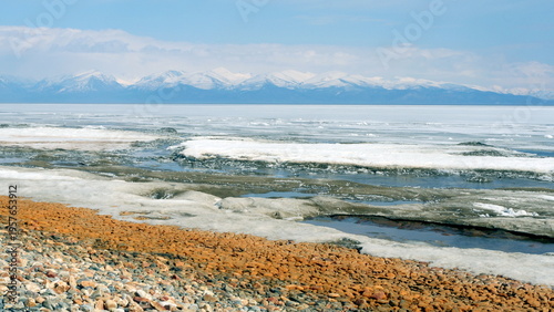 The icy shore of Lake Baikal in Russian Siberia in late spring. The northernmost point of Lake Baikal is located in the small town of Nizhneangarsk.