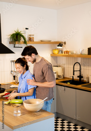 Couple enjoys cooking toget...