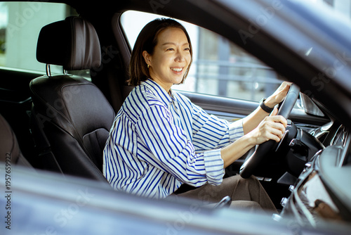 Korean woman drives a car w...
