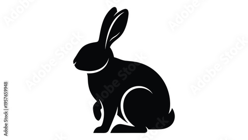 A simple black silhouette of a rabbit in a seated position facing right