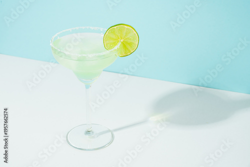 Margarita cocktail. Summer alcohol drink on blue background.