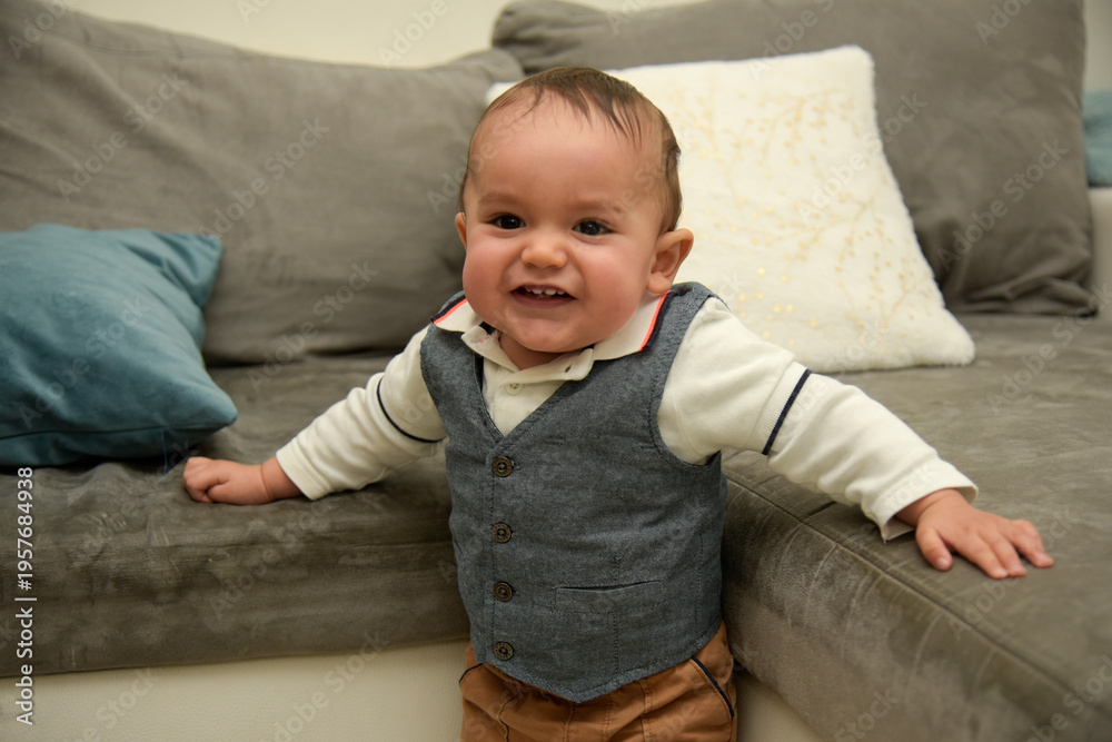 Fototapeta premium young baby taking its first steps