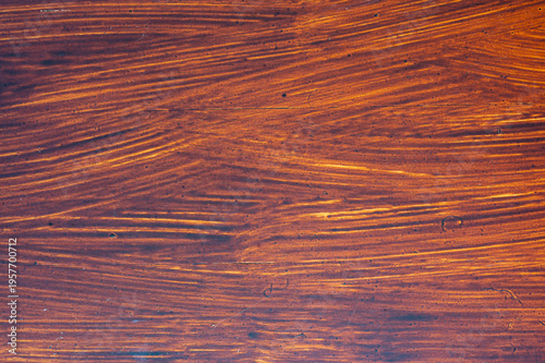 Detailed brown wooden surface with visible grain lines and warm tones, natural texture background, organic pattern for design, rustic material and abstract backdrop