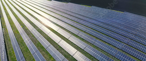 Top, view of rows of solar panels of solar power plant