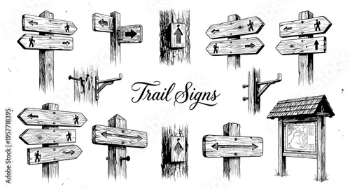 Collection of hand-drawn wooden trail signs and information boards for outdoor navigation