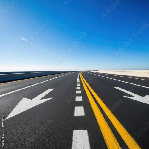 Endless Asphalt Journey Toward the Horizon Under a Clear Blue Sky