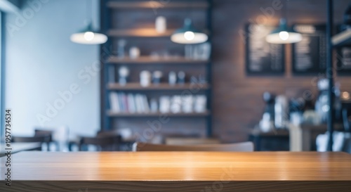 Empty wooden table top with blurred cafe or restaurant interior background.
