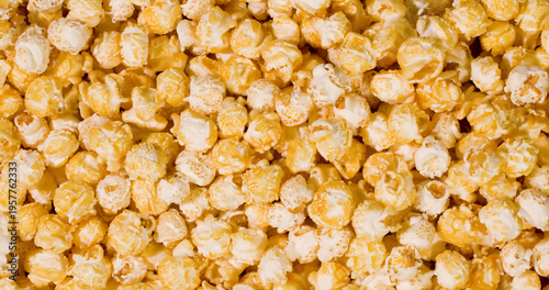 Popcorn in various flavors spread across a flat surface at a cinema snack bar during a movie screening event