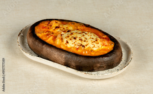 Shrimp Casserole (with cheese) Hünkar Begendi (a Turkish dish) topped with yellowish cheese sauce