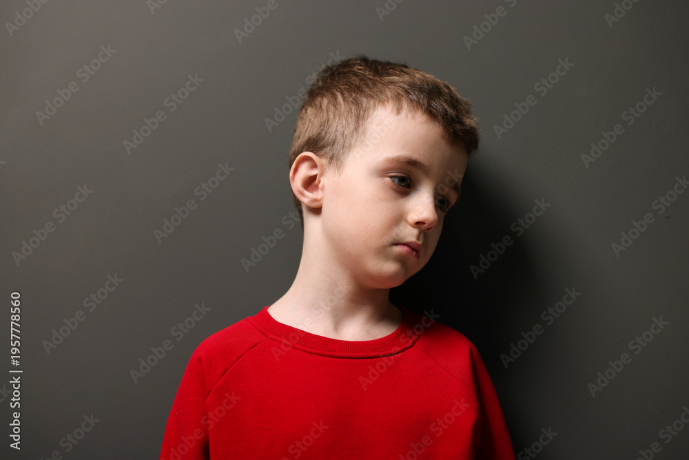Fototapeta premium Autism. Little boy with ASD on black background