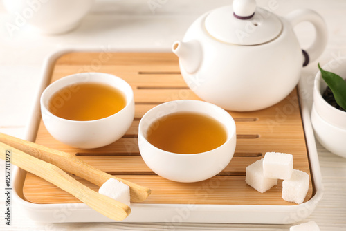 Tray with teapot, cups of g...