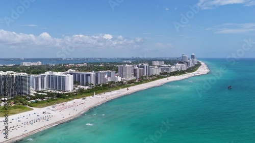 Aerial view of Miami Beach with turquoise waters. Drone shot of Miami skyline. Top view of South Beach. Miami cityscape with luxury skyscrapers and ocean. View of Miami famous coastline.