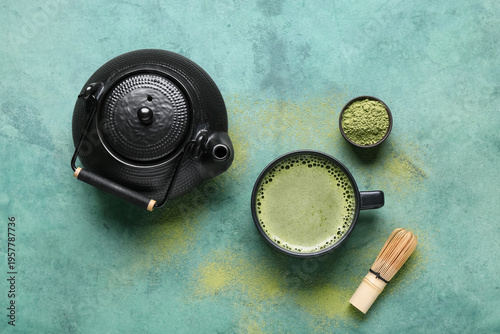 Cup of matcha tea, teapot a...