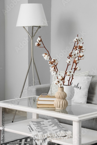 Vase with cotton flowers, e...
