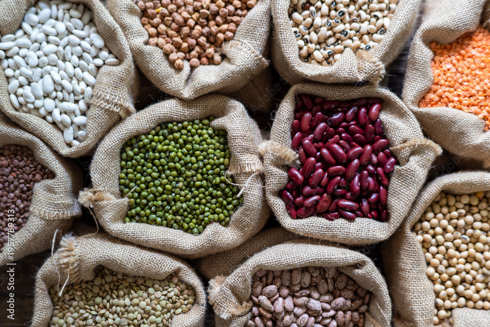 Fototapeta premium Colorful legumes in burlap sacks
