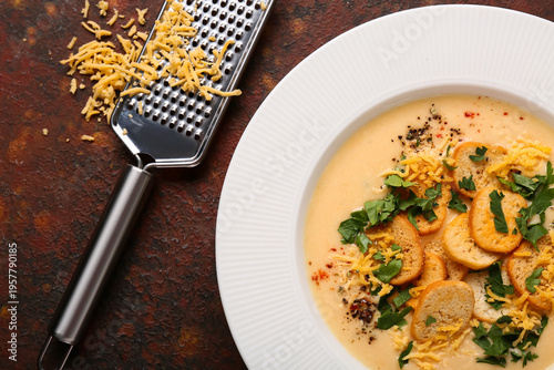 Bowl of tasty cheese soup w...