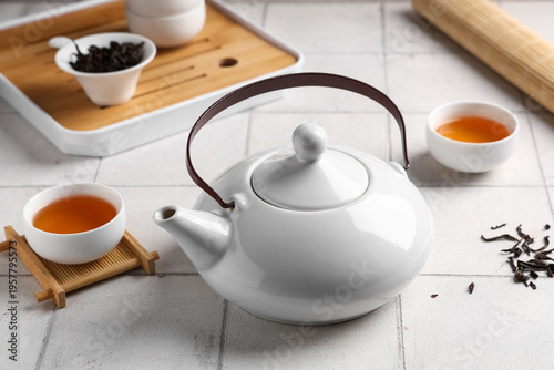 Teapot and cup of tea on wh...