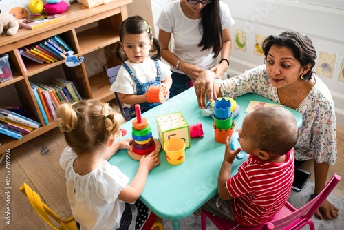 Canvas Print Children playing with colorful toys