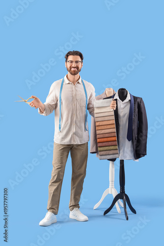 Male tailor with scissors a...