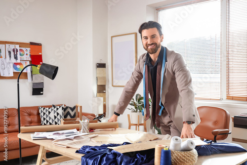 Male tailor at table in ate...