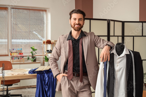 Male tailor with mannequin ...
