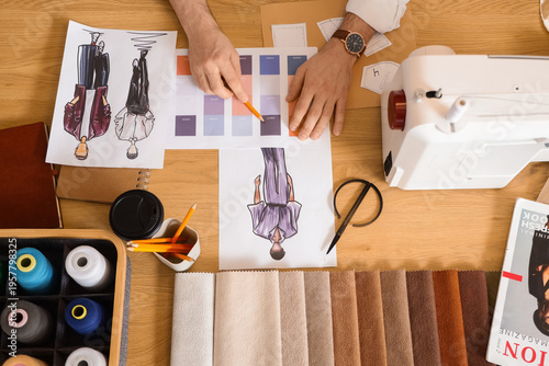 Male tailor's hands working...