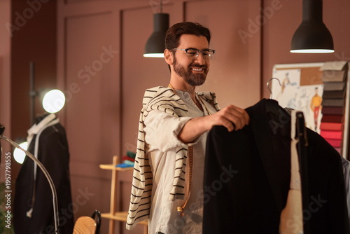 Male tailor taking clothes ...
