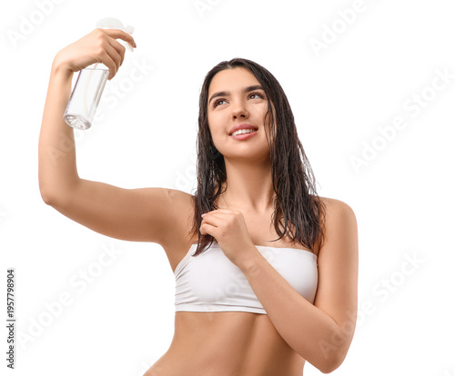 Young woman applying hair s...