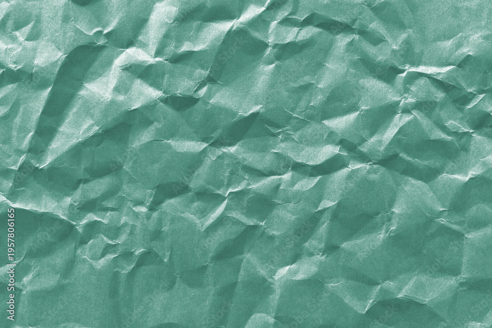 Obraz premium Textured green crumpled paper background
