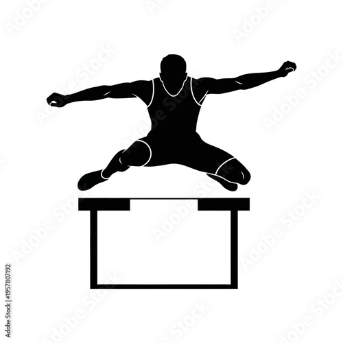 Athlete in mid air hurdle jump.